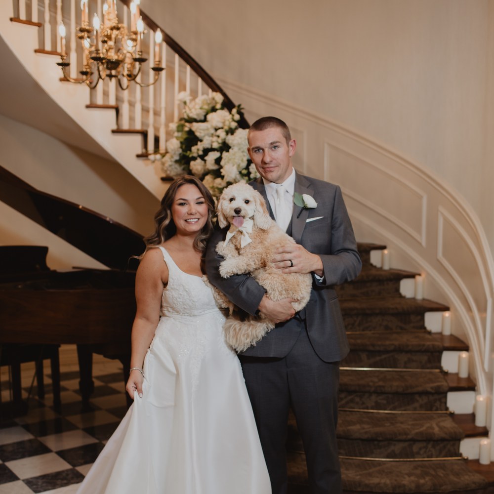 couple-goldendoodle-square Bride and groom holding their dog at The Royalton Mansion wedding