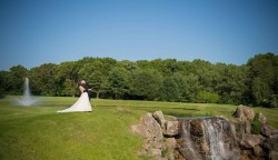 a bride and groom on a golf course