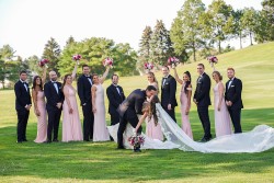 a photo of a bridal party, on a golf course