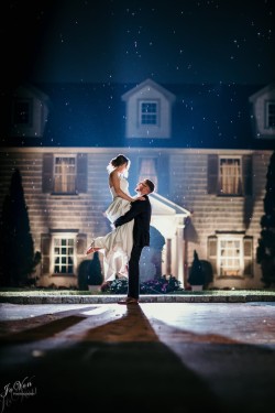 a bride and groom infront of the royalton mansion