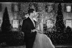 a black and white photo of a bride and groom