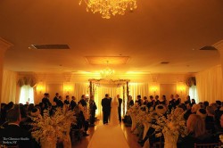 a wedding ceremony, with bride and groom at the alter
