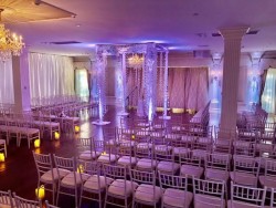 an wedding ceremony area, with empty seats awaiting guests