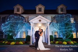 a bride and groom, infront of the royalton mansion