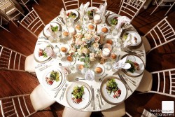 cuisine on a table with a flower centerpiece