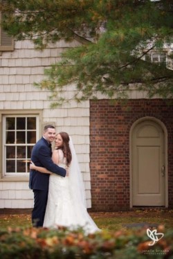 a bride and groom infront of the royalton mansion
