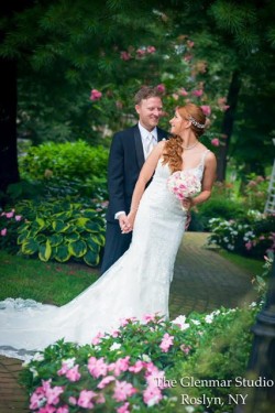 a bride and groom wedding photo, with foliage around them